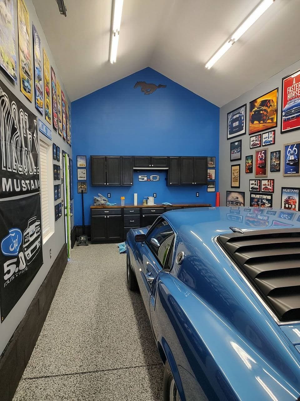 Garage renovation featuring workbench zone with overhead storage