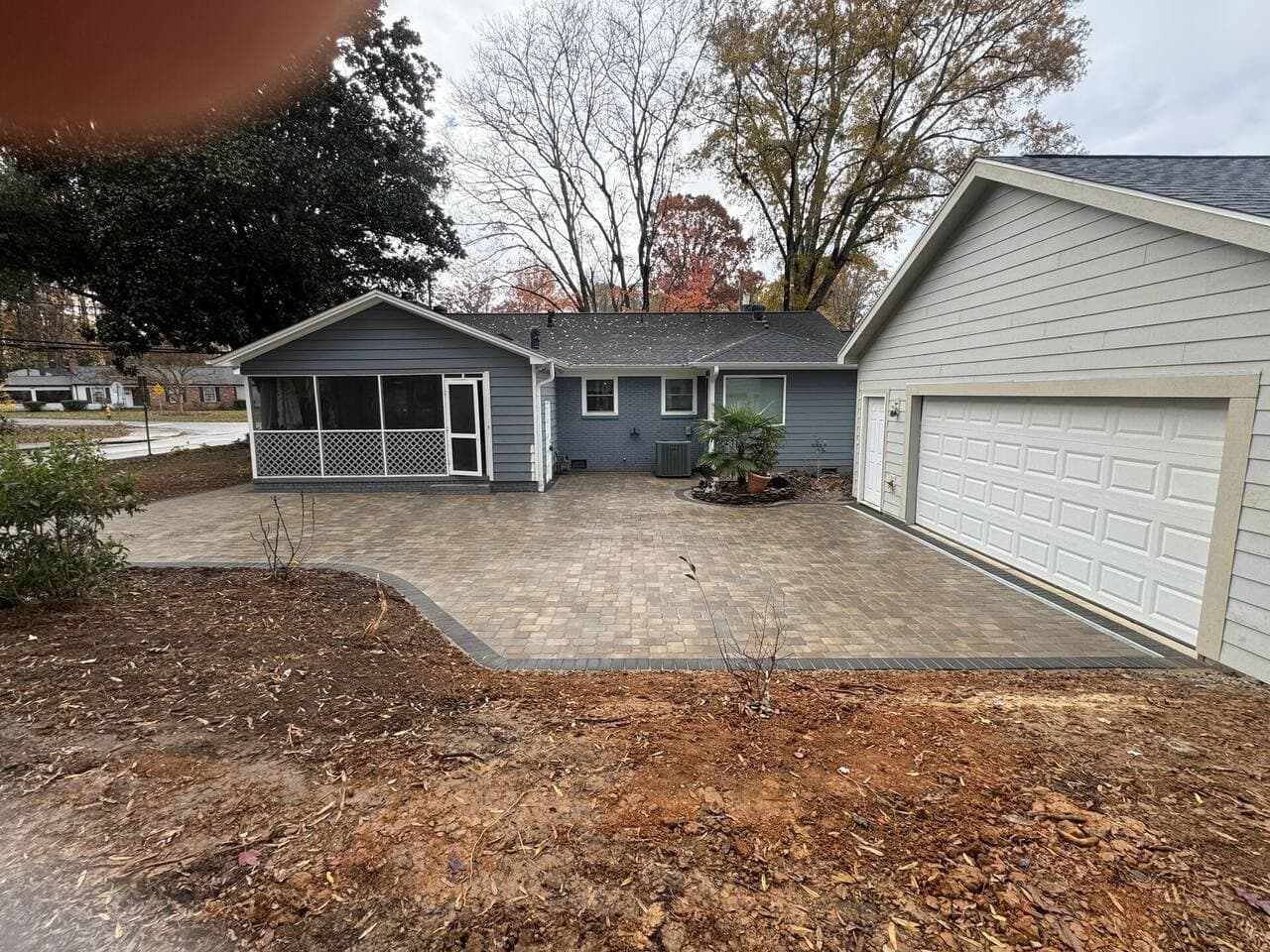 Driveway renovation showcasing smooth finished concrete