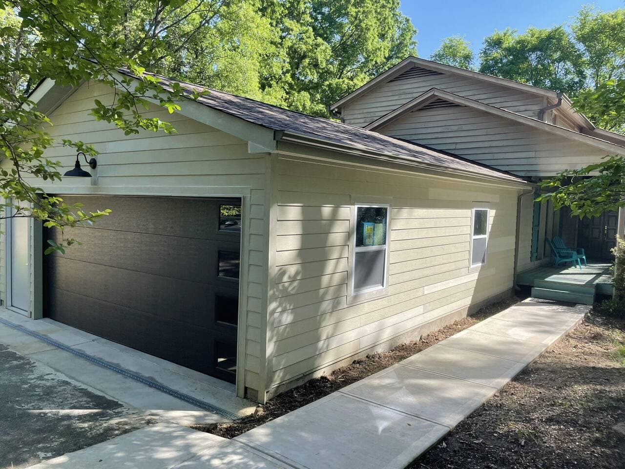 Updated detached garage with bright finishes and organized storage