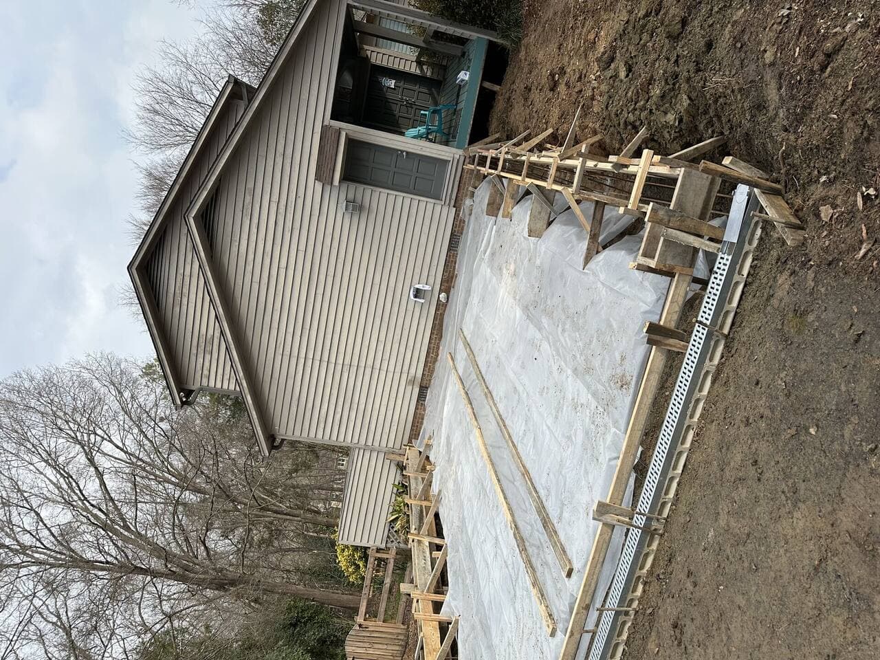 Garage entry wall lacking storage before modernization