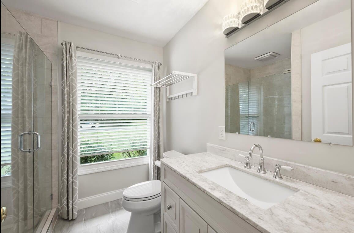Modern bathroom renovation showcasing new tile and fixtures