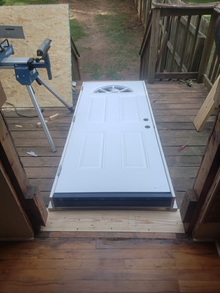 Exterior door replacement in Charlotte, NC — new prehung entry door staged for installation
