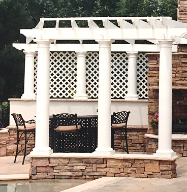 Three white greek columns with a pergola on top